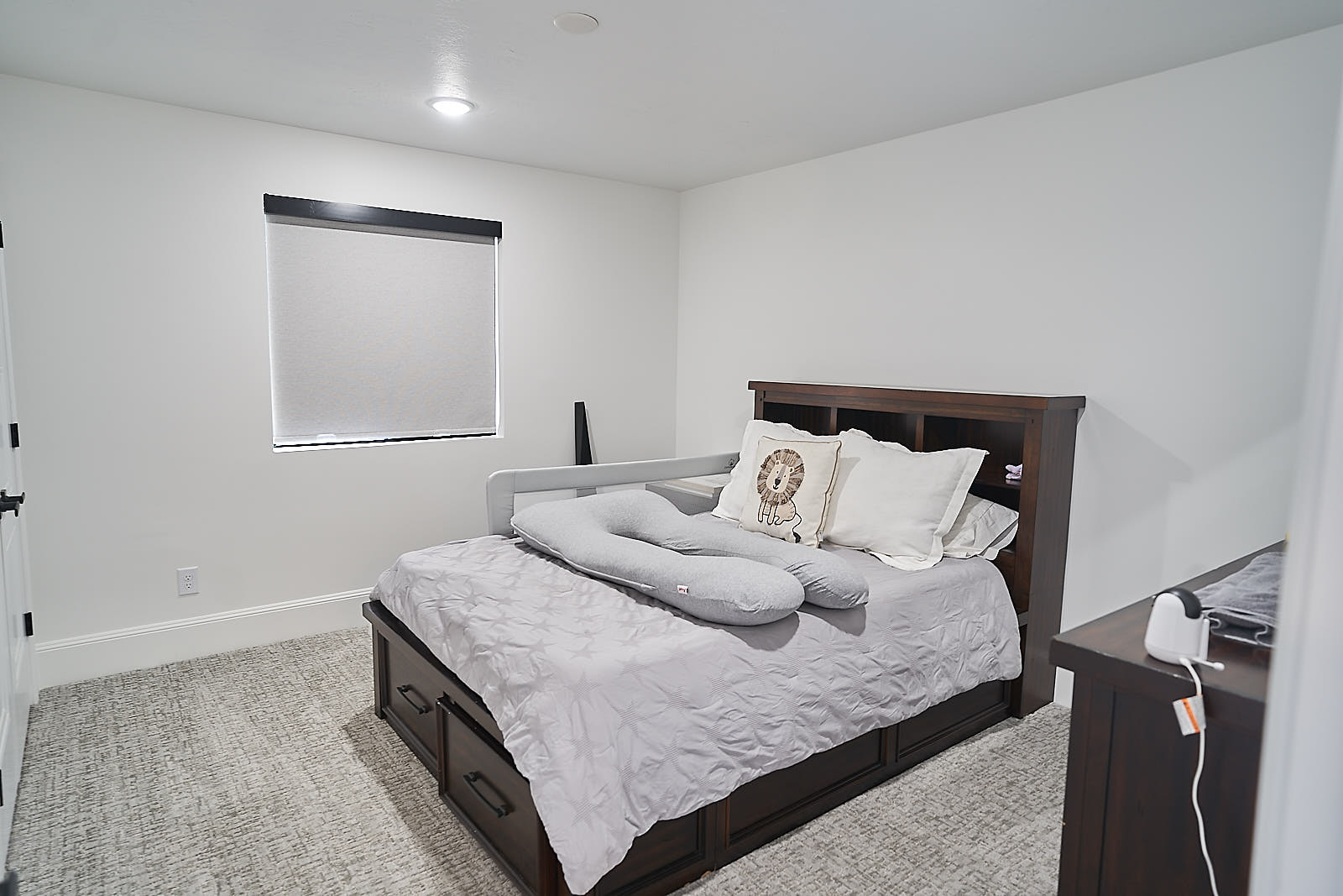 South Jordan project: Modern bedroom with dark wood bed frame and neutral decor (Photo 19/29)