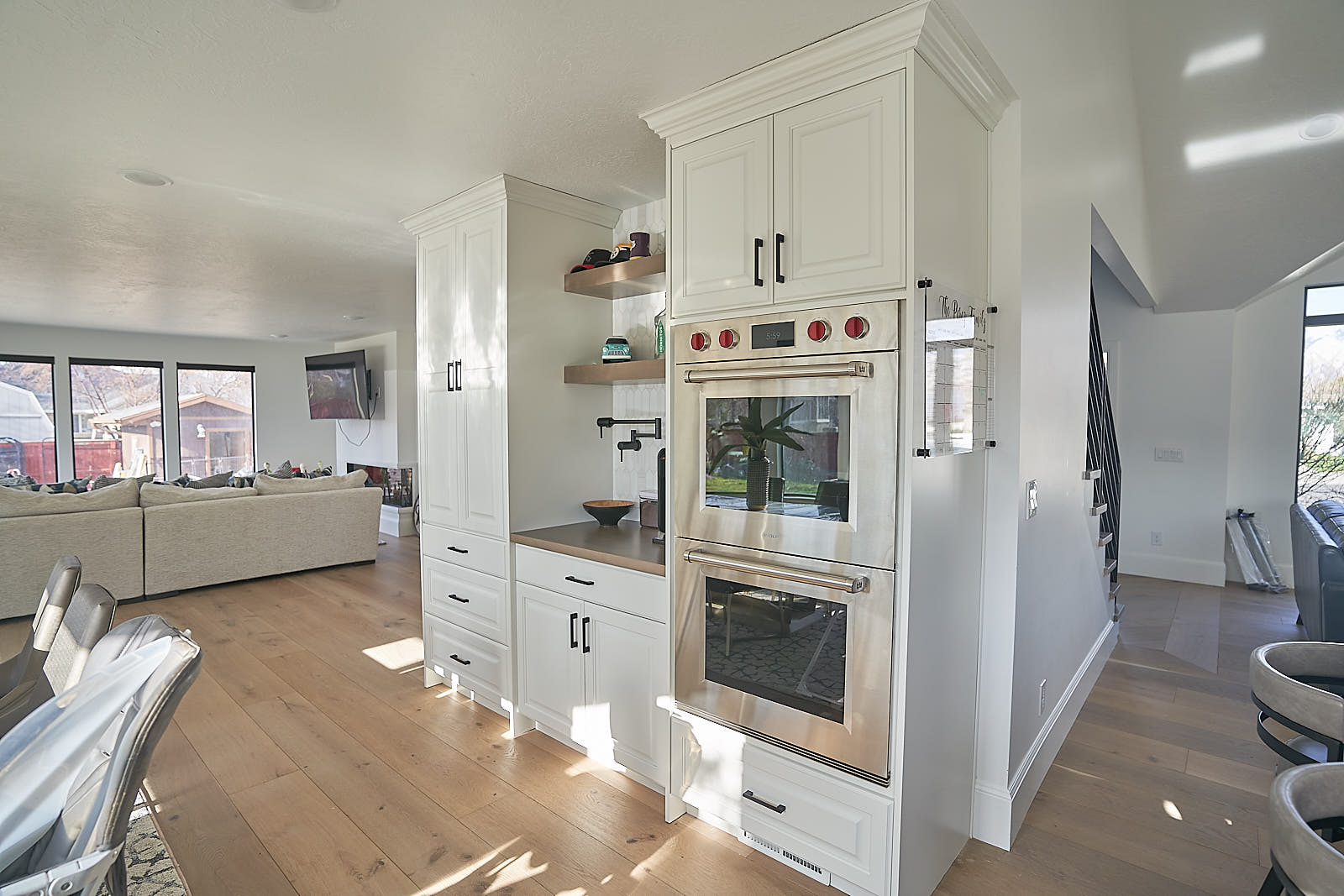 South Jordan project: Modern kitchen with white cabinetry and stainless steel double ovens (Photo 3/29)