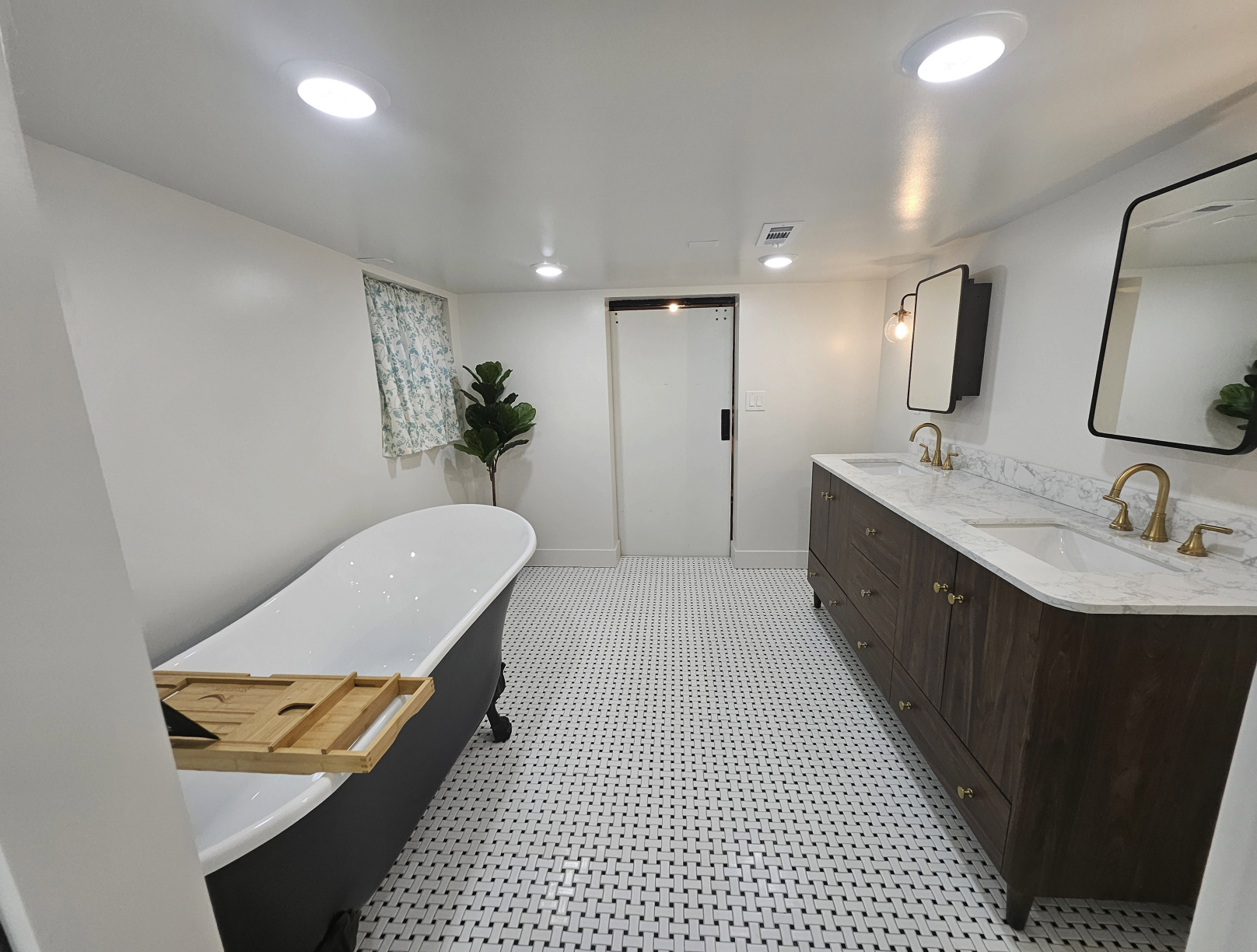 Basement project: Completed master bathroom, wide view showing vanity and tub (Photo 12/12)